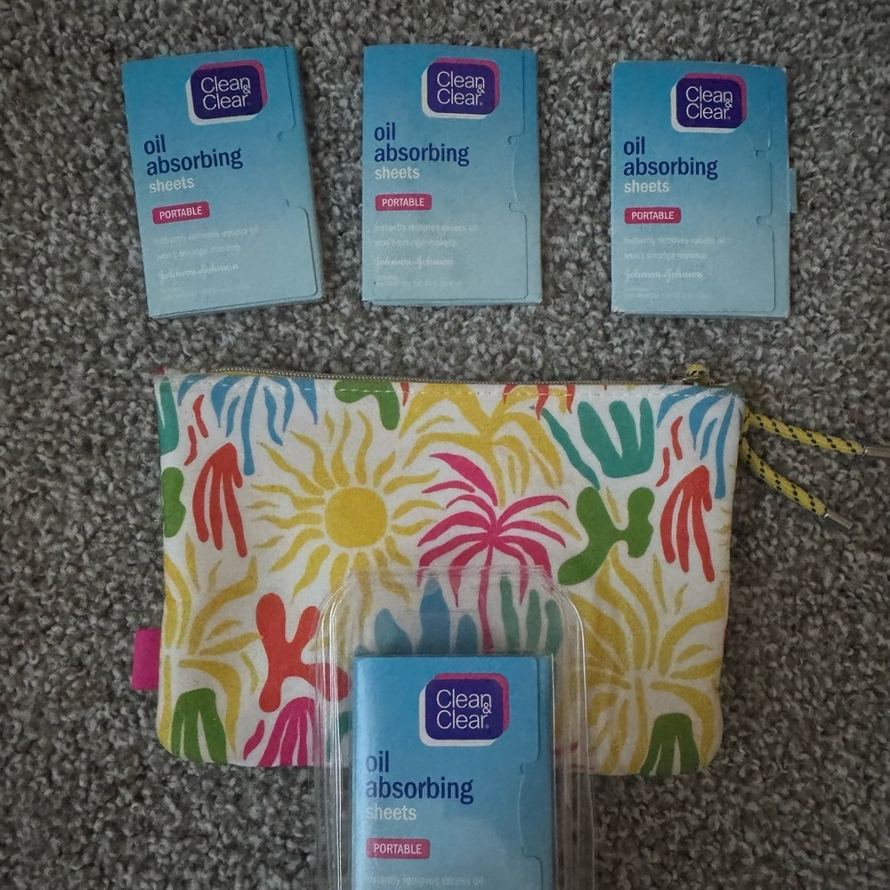 Used colorful Floral Pouch with Oil Absorbing Sheets